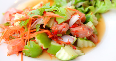 Salmon Salad on white plate.
