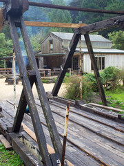 Fototapeta na wymiar Old Wooden Bridge Across To A Barn
