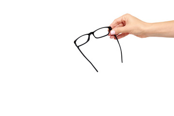 Hand with black eyeglasses, eye optic correction tool.