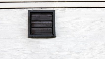 Vents at the white wooden building