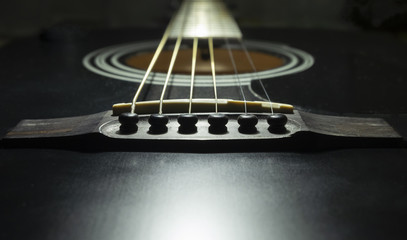 Fototapeta premium Black guitar on a dark background