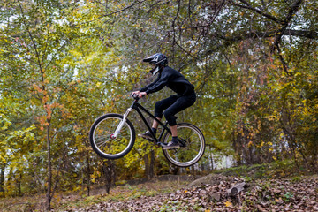 Extreme cycling concept: mountain bike rider makes a jump.