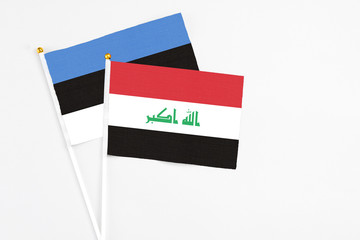 Iraq and Estonia stick flags on white background. High quality fabric, miniature national flag....