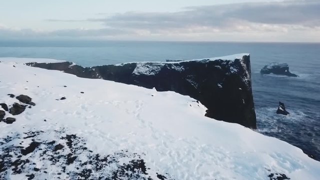 Iceland Aerial View Revealing Large Mountain Arch With Ocean Below 1