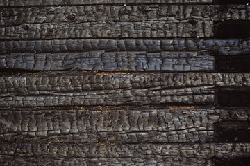 wood charred wall after fire
