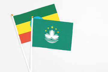Macao and Ethiopia stick flags on white background. High quality fabric, miniature national flag. Peaceful global concept.White floor for copy space.