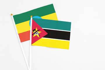 Mozambique and Ethiopia stick flags on white background. High quality fabric, miniature national...