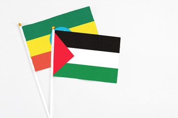 Palestine and Ethiopia stick flags on white background. High quality fabric, miniature national...