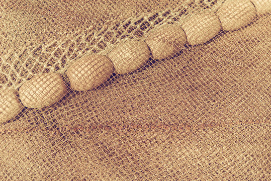 Abstract fishing net closeup. Vintage background image with film grain.