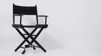 Small clapper board or movie slate with director chair use in video production or movie and cinema industry. It's put on white background.