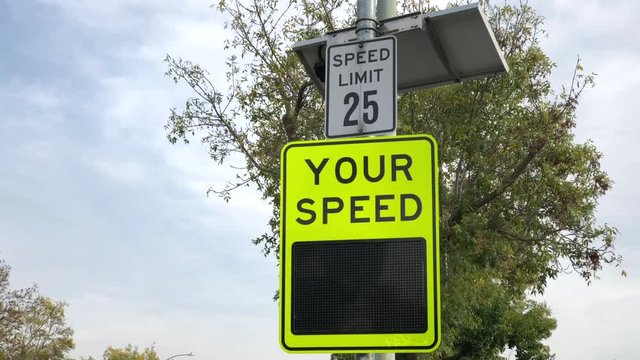 4K HD video of Radar speed sign, also known as driver feedback sign, a traffic calming devices designed to slow speeders down by alerting them of their speed. Shown to be effective to control speeding