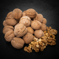 Walnuts on black background. Group walnuts on Healthy organic food concept.