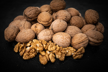 Walnuts on black background. Group walnuts on Healthy organic food concept.