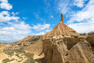 Adust riverbed in the canyon near the single rock Castildetierra in the Spanish desert Bardenas...