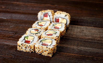 Sushi rolls on a wooden table