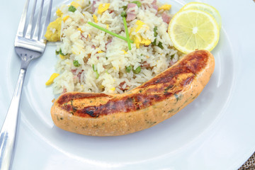 salmon sausage and Cantonese rice on a plate