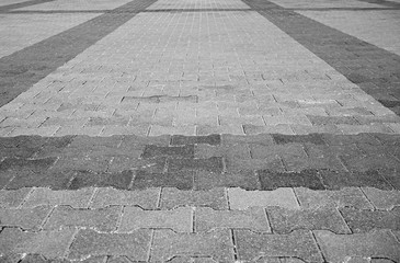 Perspective View Monotone Gray Brick Stone Pavement on The Ground for Street Road. Sidewalk, Driveway, Pavers, Pavement in Vintage Design Ground Flooring Square Pattern Texture Background