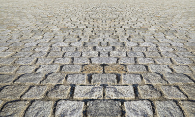 Perspective View Monotone Gray Brick Stone Pavement on The Ground for Street Road. Sidewalk, Driveway, Pavers, Pavement in Vintage Design Ground Flooring Square Pattern Texture Background