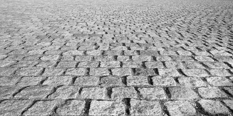 Perspective View Monotone Gray Brick Stone Pavement on The Ground for Street Road. Sidewalk, Driveway, Pavers, Pavement in Vintage Design Ground Flooring Square Pattern Texture Background