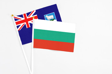Bulgaria and Falkland Islands stick flags on white background. High quality fabric, miniature national flag. Peaceful global concept.White floor for copy space.