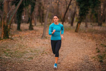 Female Athlete Jogging in the Park