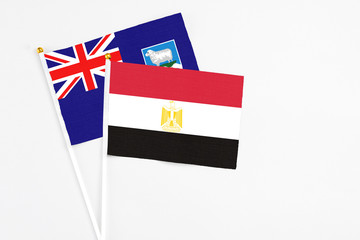 Egypt and Falkland Islands stick flags on white background. High quality fabric, miniature national flag. Peaceful global concept.White floor for copy space.