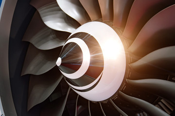 Turbo jet engine of airplane, close up in the light sparkle reflection.