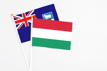 Hungary and Falkland Islands stick flags on white background. High quality fabric, miniature national flag. Peaceful global concept.White floor for copy space.