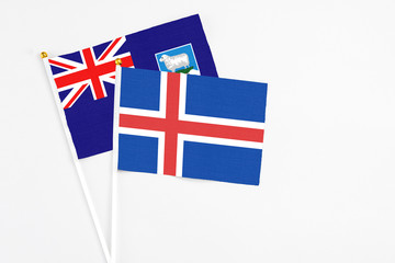 Iceland and Falkland Islands stick flags on white background. High quality fabric, miniature...