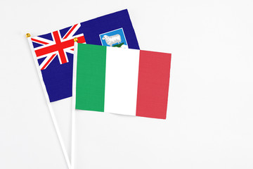 Italy and Falkland Islands stick flags on white background. High quality fabric, miniature national flag. Peaceful global concept.White floor for copy space.