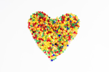 Colorful beads, heart shape space for photo or text isolated on white background. Valentine's Day