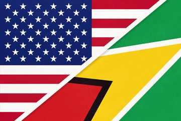 USA vs Guyana national flag. Relationship between two countries.