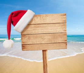 Christmas party on beach signboard as background