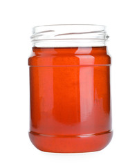 Open glass jar of wildflower honey isolated on white