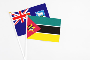 Mozambique and Falkland Islands stick flags on white background. High quality fabric, miniature...