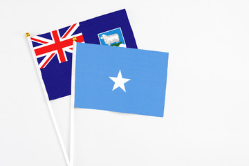 Somalia and Falkland Islands stick flags on white background. High quality fabric, miniature...