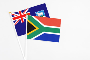 South Africa and Falkland Islands stick flags on white background. High quality fabric, miniature national flag. Peaceful global concept.White floor for copy space.