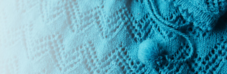 Abstract knitting fabric background. Turquoise blue White texture background from merino knitted blanket, scandinavian minimalism backdrop with copy space, top view. Banner, card concept design