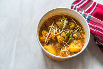 Take Away Indian Food Spicy Masaledar Aloo Gobi with Soybean Sprouts and Beans Tawa Sabzi in Plastic Cup Box Package / Container.