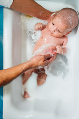 Fototapeta premium Baby boy in the bath tub
