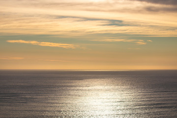 Fototapeta premium Beautiful and peaceful pastel sunset or sunrise over the ocean.