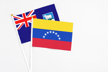 Venezuela and Falkland Islands stick flags on white background. High quality fabric, miniature national flag. Peaceful global concept.White floor for copy space.