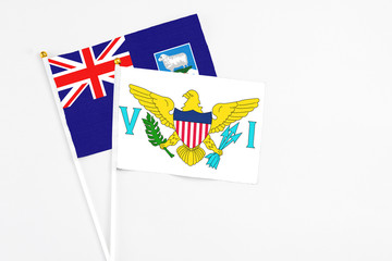 United States Virgin Islands and Falkland Islands stick flags on white background. High quality fabric, miniature national flag. Peaceful global concept.White floor for copy space.