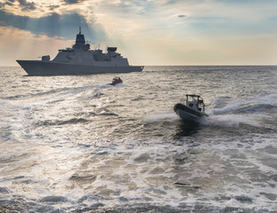 Nato war ship during exersice at the sea.