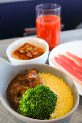 photo of Food served on board of business class airplane on the table