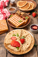 assorted of crepe, pancake and waffle with fruit and chocolate