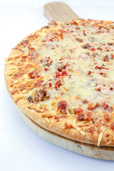 whole pizza with ham and mozzarella on a white background