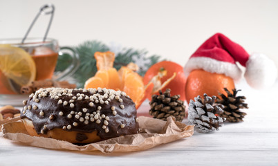 Donut served with tea on white wooden table