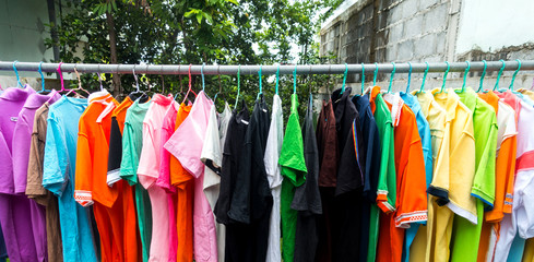 Multi colored Used Shirt with hangers.Dry clothes in hangers.