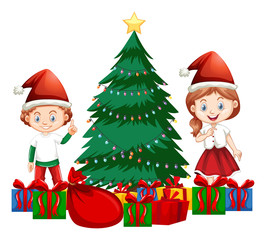 Boy and girl standing by christmas tree